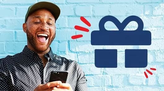 Spur Gifting image - man smiling while looking at his phone